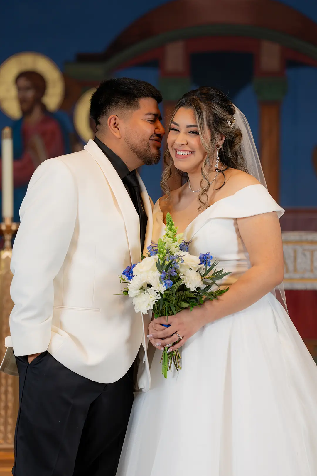 Groom and bride smiling on their wedding day